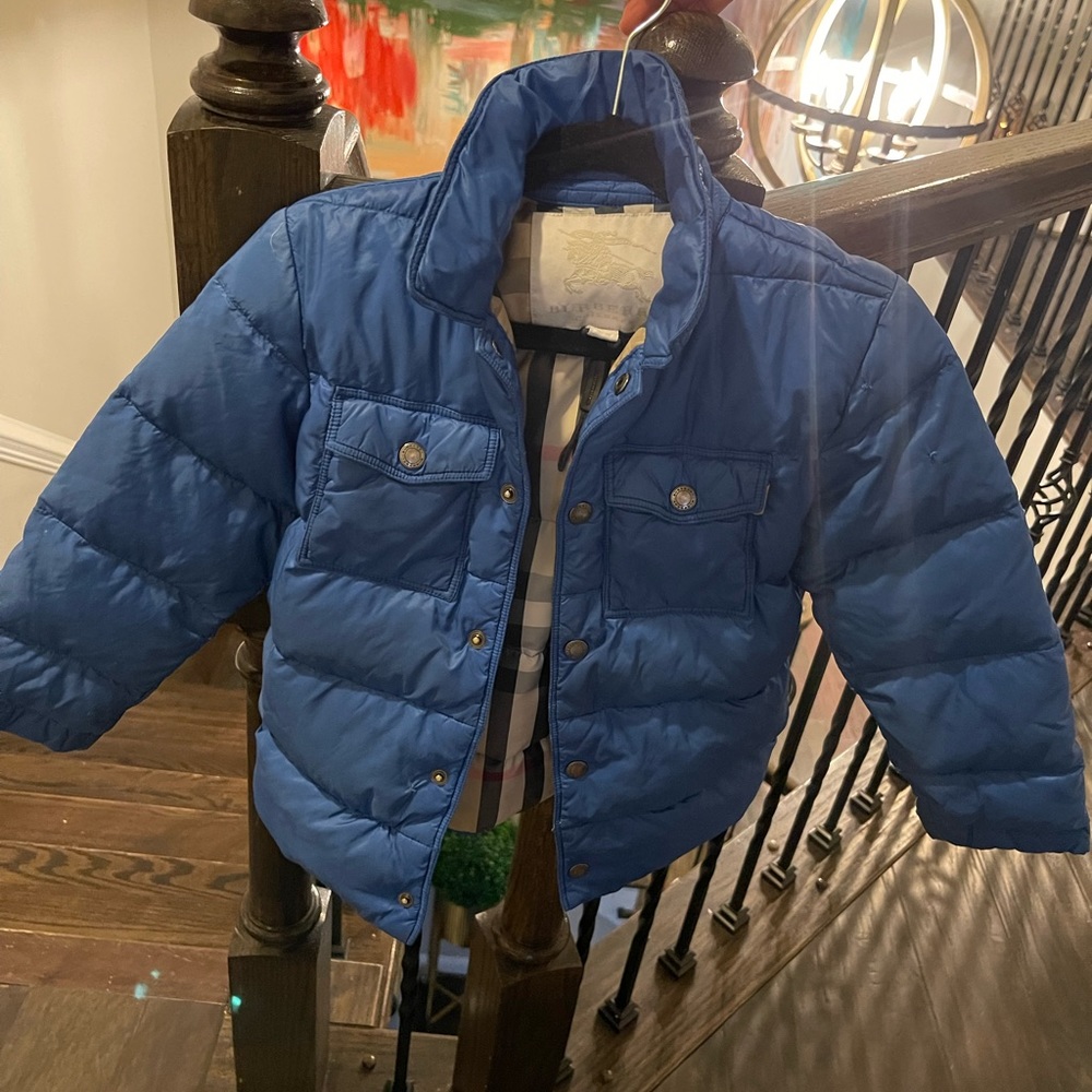 Burberry blue coat, a little torn but barely can see.